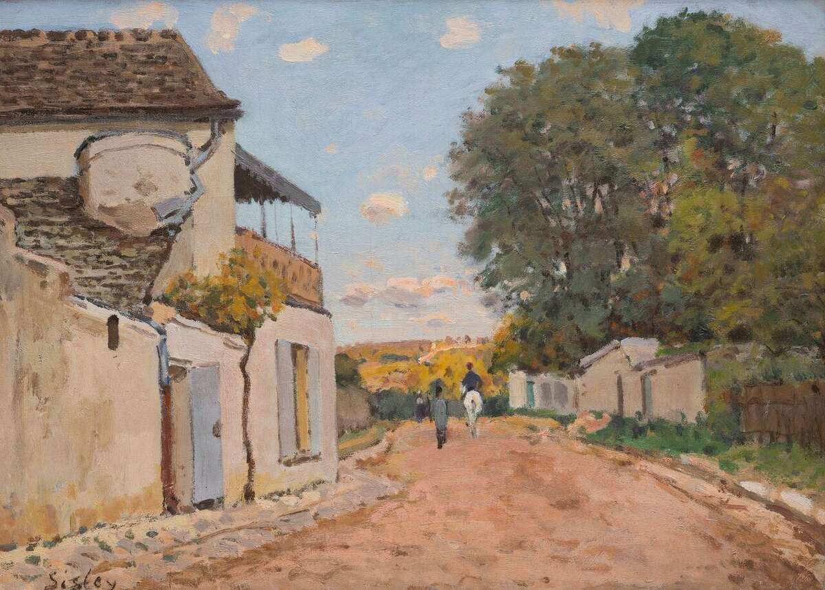 Alfred Sisley’s “The Rue de la Princesse, Louveciennes,” about 1873, an oil on canvas on loan to the Bruce Museum from the Phillips Family Collection.