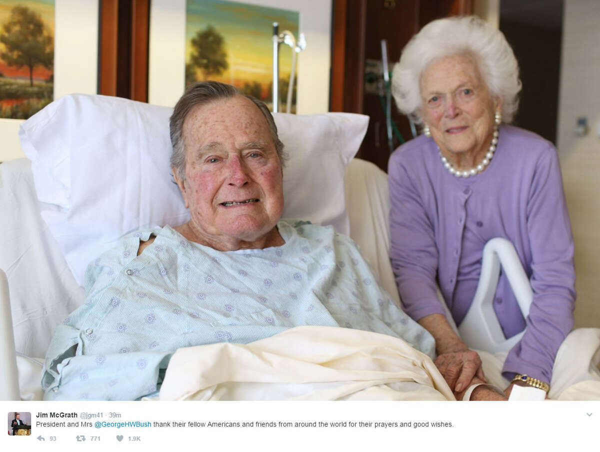 President George H. W. Bush and wife Barbara smile as she visits him in the hospital. Continue clicking to learn more about their 72-year love story. Source: Twitter