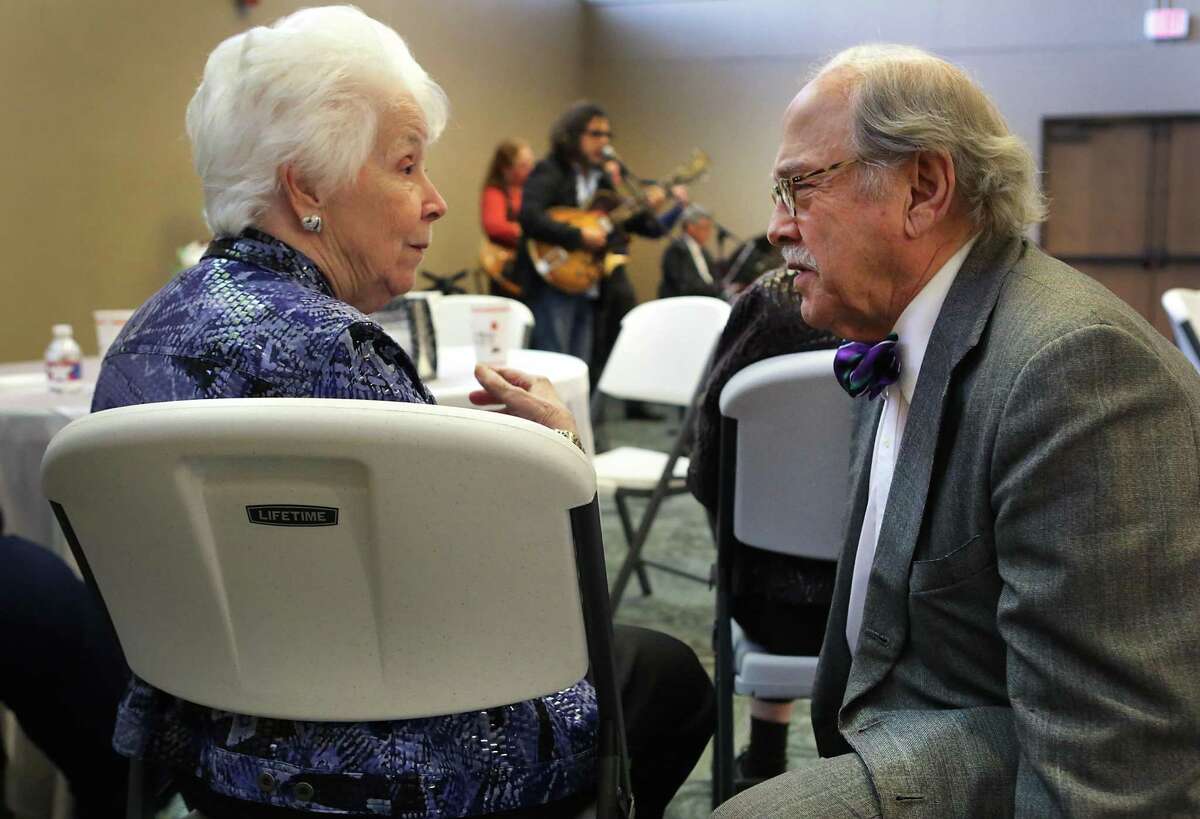 Ida Campesi, left, wife of Sebastian Campesi, receives greetings from jazz musician Jim Cullum Jr. as friends and family members of local jazz violinist and music teacher Sebastian Campesi remember the beloved musician with a funeral Mass at Porter Loring Mortuary followed by a music jam session at Redeemer Presbyterian Church, with many of his friends that he played with over the years.