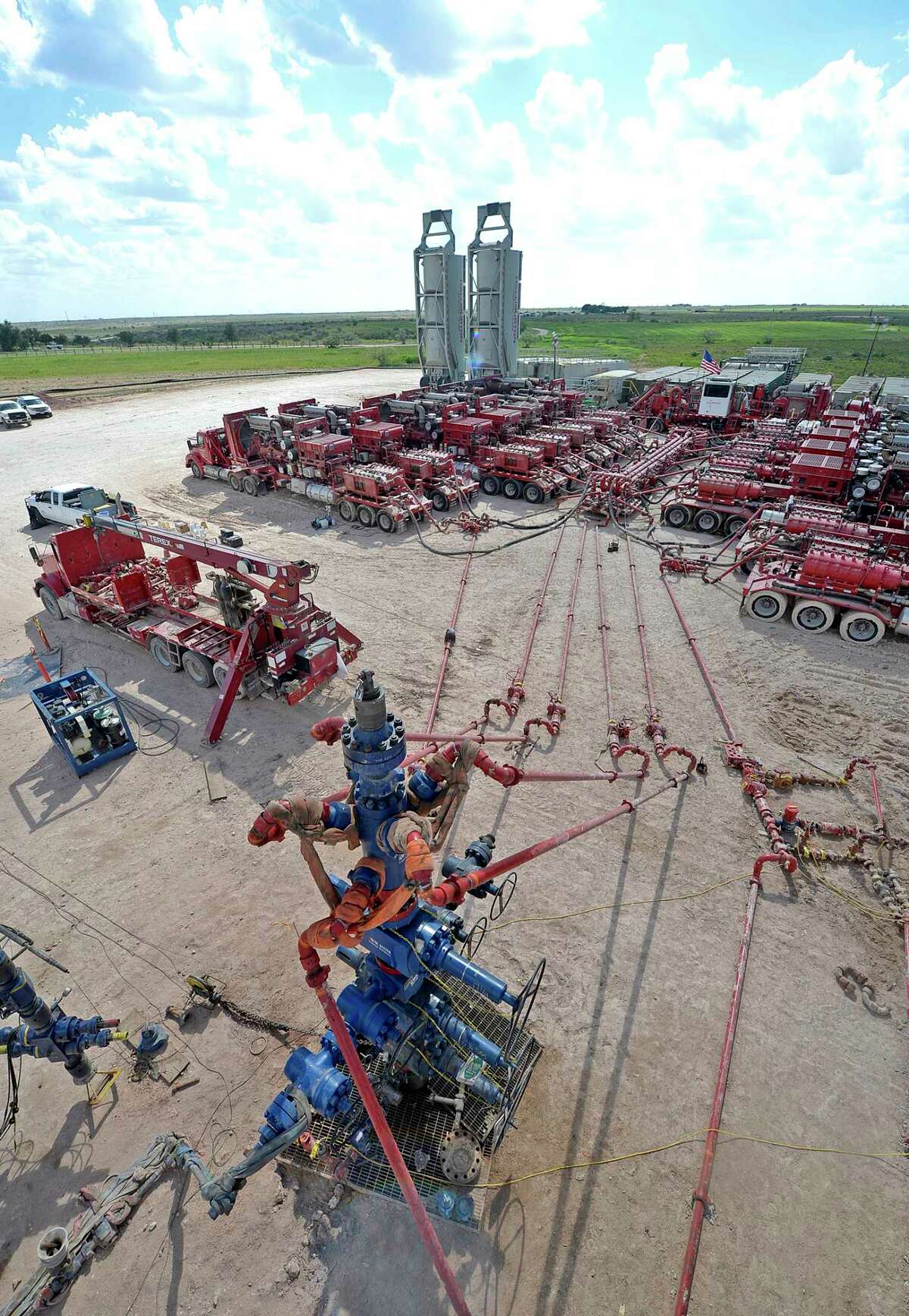 Aerial view of a fracking wellhead powered by a series of Halliburton pumping units at a fracking site managed by Octane Energy on Friday, Sept. 23, 2016 near Stanton. James Durbin/Reporter-Telegram