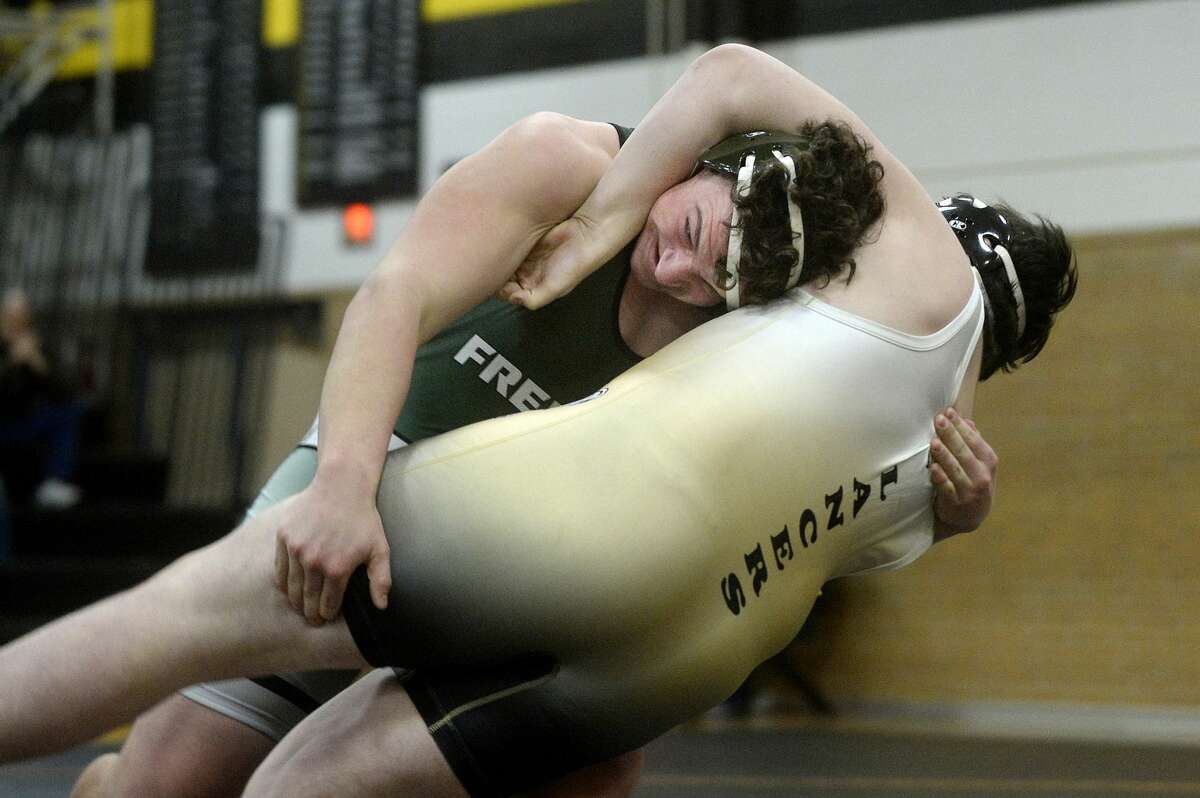 Freeland's Chase Crook, left, takes down Bullock Creek's Jackson Lambert in their 285-pound match during a wrestling tri-meet on Monday at Bullock Creek High School. Crook won the match.