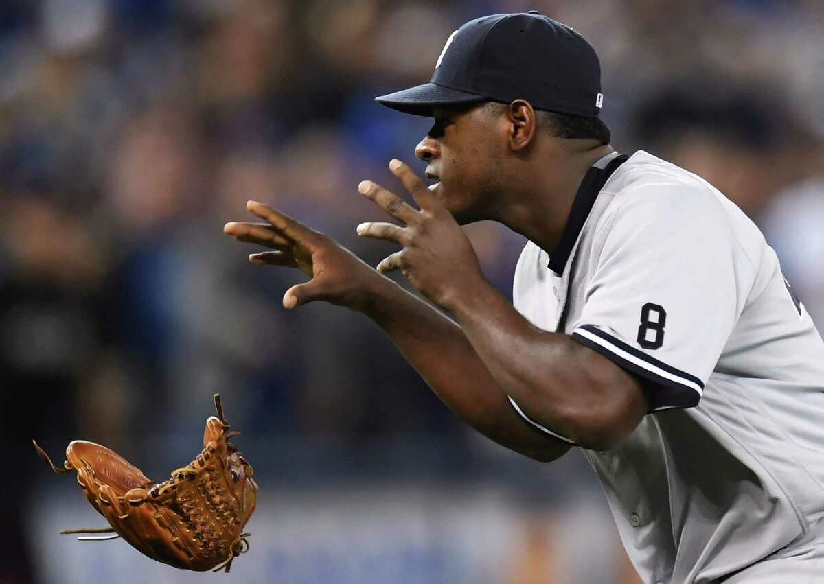 New York Yankees pitcher Luis Severino throws away his glove as he approaches Toronto Blue Jays' Justin Smoak after hitting him with a pitch during the second inning of a baseball game Monday, Sept. 26, 2016, in Toronto. (Frank Gunn/The Canadian Press via AP) ORG XMIT: FNG508