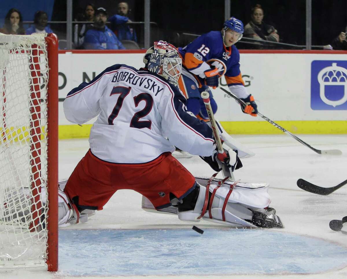 New York Islanders' Josh Bailey (12) watches his shot get past Columbus Blue Jackets goalie Sergei Bobrovsky (72) for a goal during the second period of an NHL hockey game, Tuesday, Jan. 24, 2017, in New York. (AP Photo/Frank Franklin II) ORG XMIT: NYFF106
