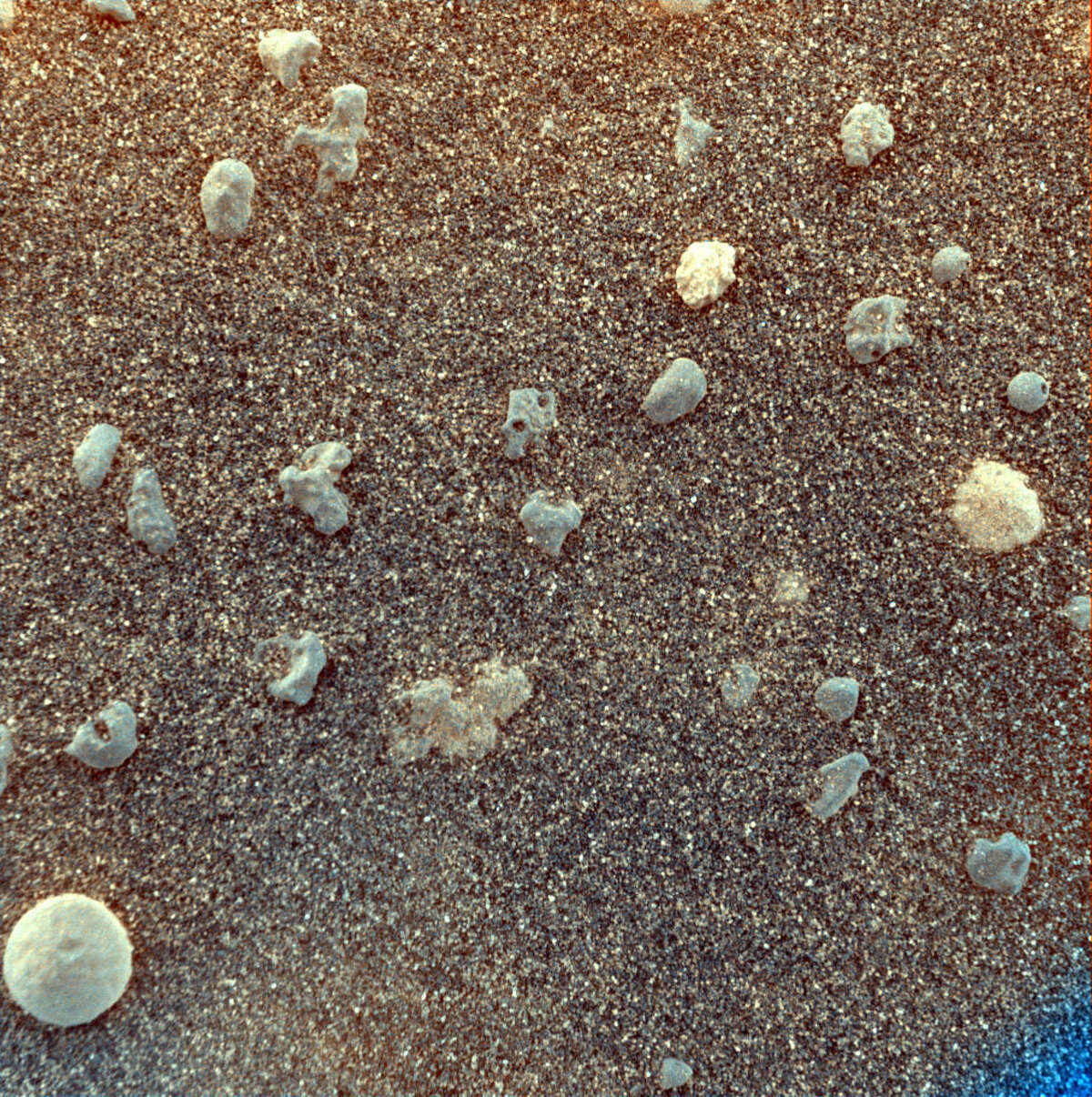 Martian soil, up close A magnified view of Martian soil using Opportunity's microscopic imager. Date: February 4, 2004.