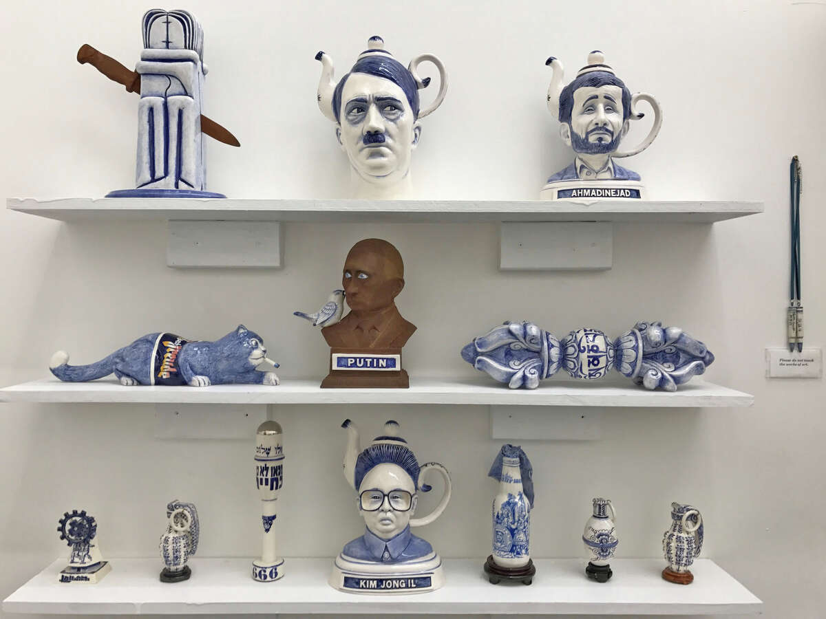Charles Krafft's display of slip-cast porcelain objects featuring images of dictators is among works on view at Zoya Tommy Gallery.