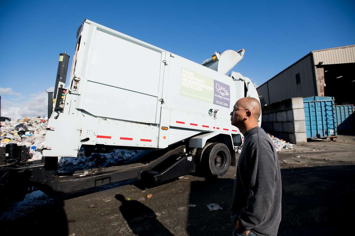 Daniel Maher, recycling director at the Ecology Center, watches a truck unload on Wednesday, Jan. 25, 2017, in Berkeley, Calif. Maher, who immigrated from Macau as a toddler, is fighting to remain in the United States.