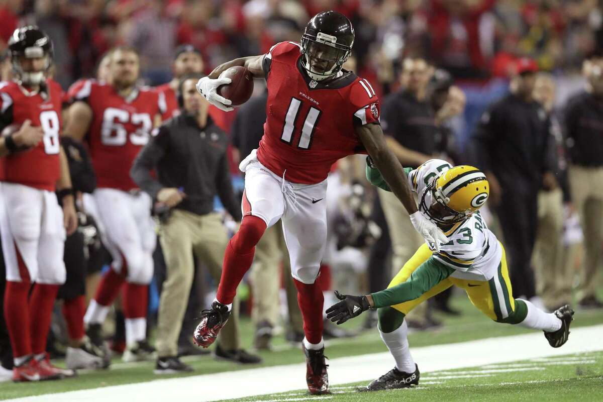 Julio Jones of the alcons runs after a catch for a 73-yard touchdown against Damarious Randall of the Green Bay Packers in the third quarter in the NFC championship game at the Georgia Dome on Jan. 22, 2017 in Atlanta.
