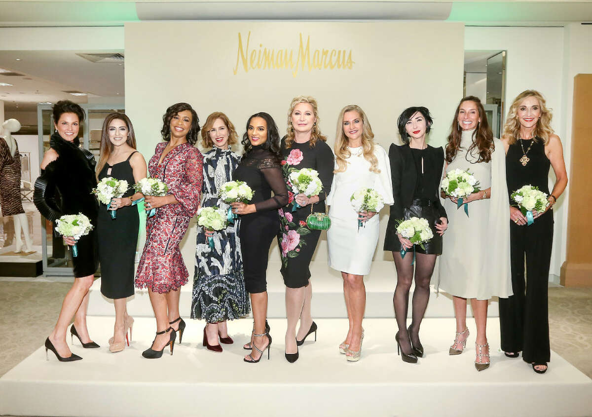Houston Chronicle's Best Dressed honorees, from left, Jessica Rossman, Sneha Merchant, Gina Gaston Elie, Carolyn Dorros, Clerenda McGrady, Carol Linn, Mary D'Andrea, Carrie Brandsberg-Dahl, Lisa Holthouse and Jana Arnoldy pose for a photo at the Best Dressed Announcement Party at Neiman Marcus in the Galleria, Wednesday, Jan. 25, 2017. ( Jon Shapley / Houston Chronicle)