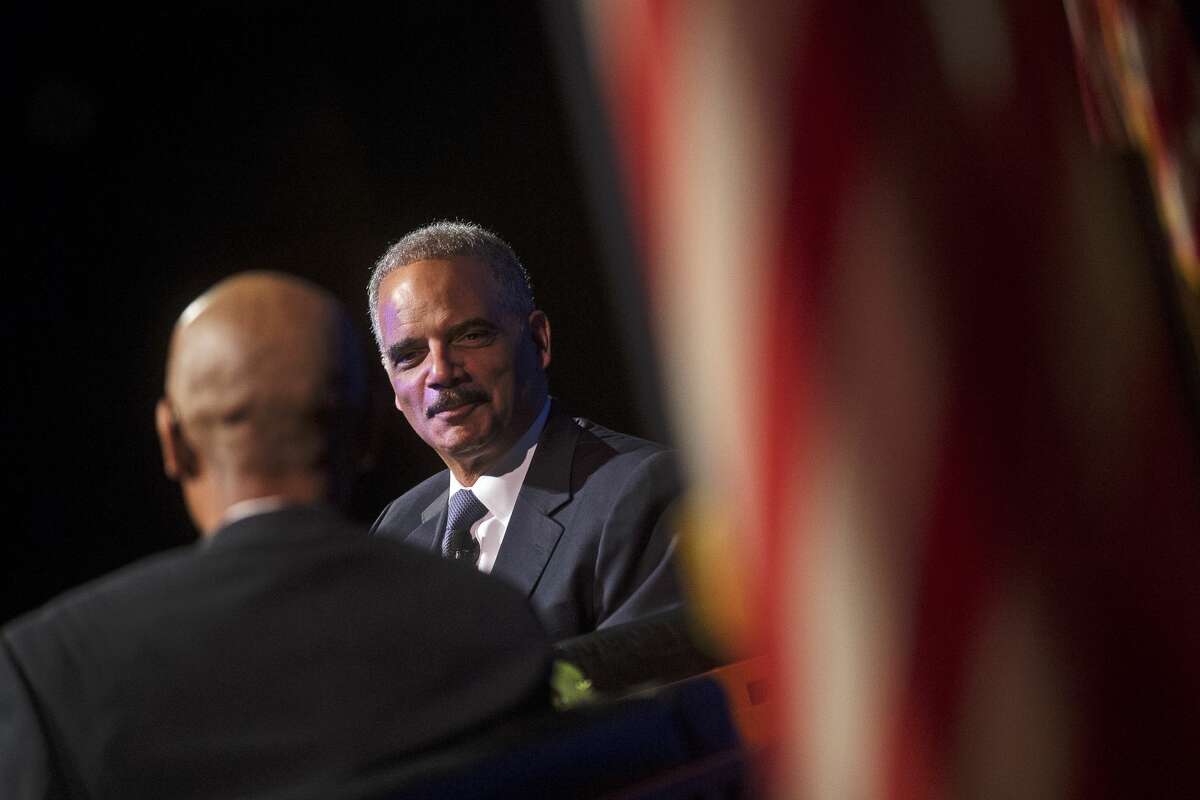 Former U.S. Attorney General Eric Holder speaks during the Eighth Annual Great Lakes Bay Regional MLK Jr. Celebration on Wednesday at Saginaw Valley State University's Malcolm Field Theatre for Performing Arts. Holder served as the first African-American Attorney General from 2009 to 2015. Guided by Saginaw's Chief Judge Terry L. Clark of the 70th Judicial District Court, Holder talked about his upbringing, his time in the White House and more. As Holder recalls, when President Obama called to offer him the position, he ended the call with "Let's go make some history."