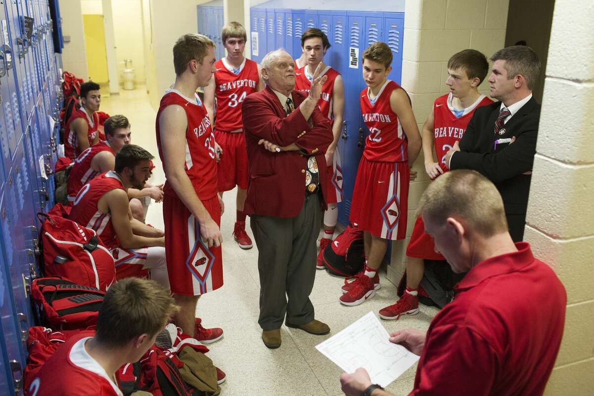 Beaverton's coach Roy Johnston speaks with his players in the locker room during halftime in a game against Harrison High School at Harrison High School on Wednesday.