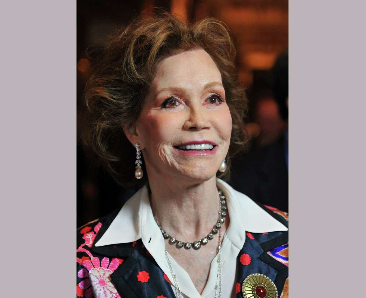 FILE - This Jan. 8, 2012 file photo shows actress Mary Tyler Moore at the taping of "Betty White's 90th Birthday: A Tribute To America's Golden Girl" in Los Angeles. Moore died Wednesday, Jan. 25, 2017, at age 80. (AP Photo/Vince Bucci, File) ORG XMIT: NYET331