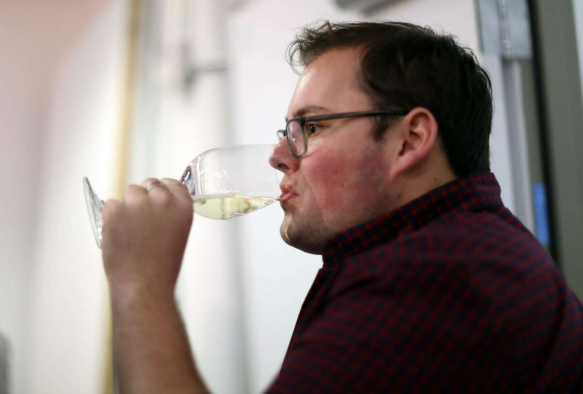 Foot of the Bed Cellars' wine club member Travis Seville during wine pick up party in San Francisco, Calif., on Wednesday, January 25, 2017.