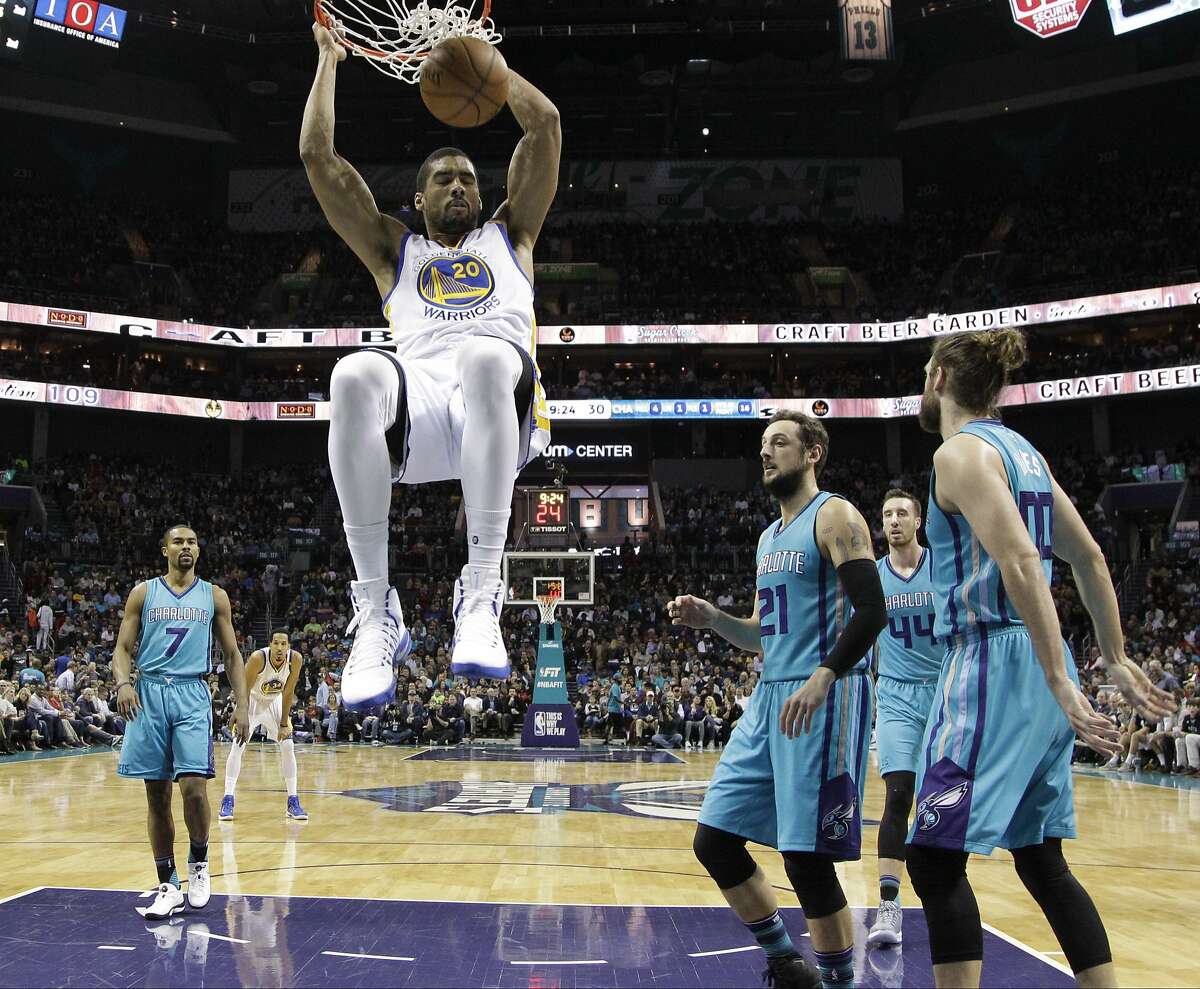 Golden State Warriors' James Michael McAdoo (20) dunks against the Charlotte Hornets in the first half of an NBA basketball game in Charlotte, N.C., Wednesday, Jan. 25, 2017. (AP Photo/Chuck Burton)