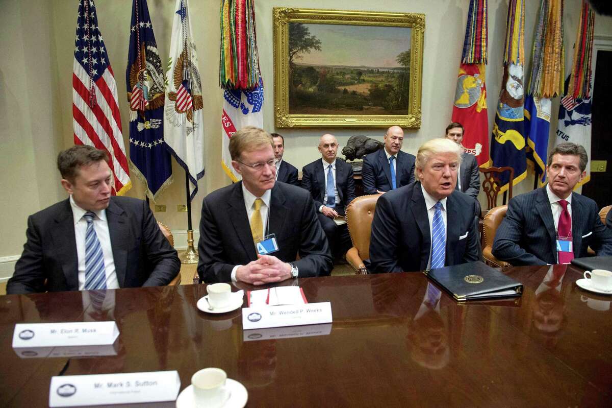 President Donald Trump meets with business leaders, including Elon Musk (left), Monday in the Roosevelt Room. “Elon Musk has an important line of communication to Donald Trump,” Morgan Stanley analyst Adam Jonas says. “This strategic relationship between Tesla leadership and the new administration is an important development.”