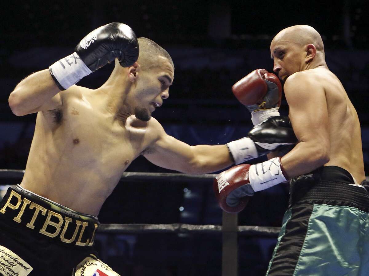 Javier Rodriguez (left) and Alejandro Moreno exchange punches during their super bantamweight bout part of the Premier Boxing Champions card on Dec. 12, 2015 at the AT&T Center. Rodriguez won by unanimous decision.