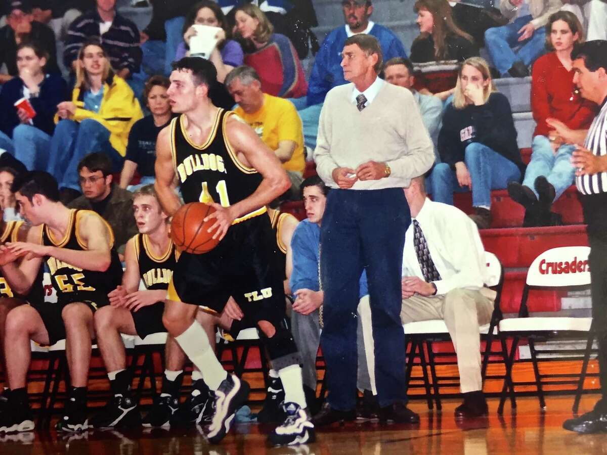 Texas Lutheran men’s basketball coach Jim Shuler works the sideline during a game at Incarnate Word in 1999.