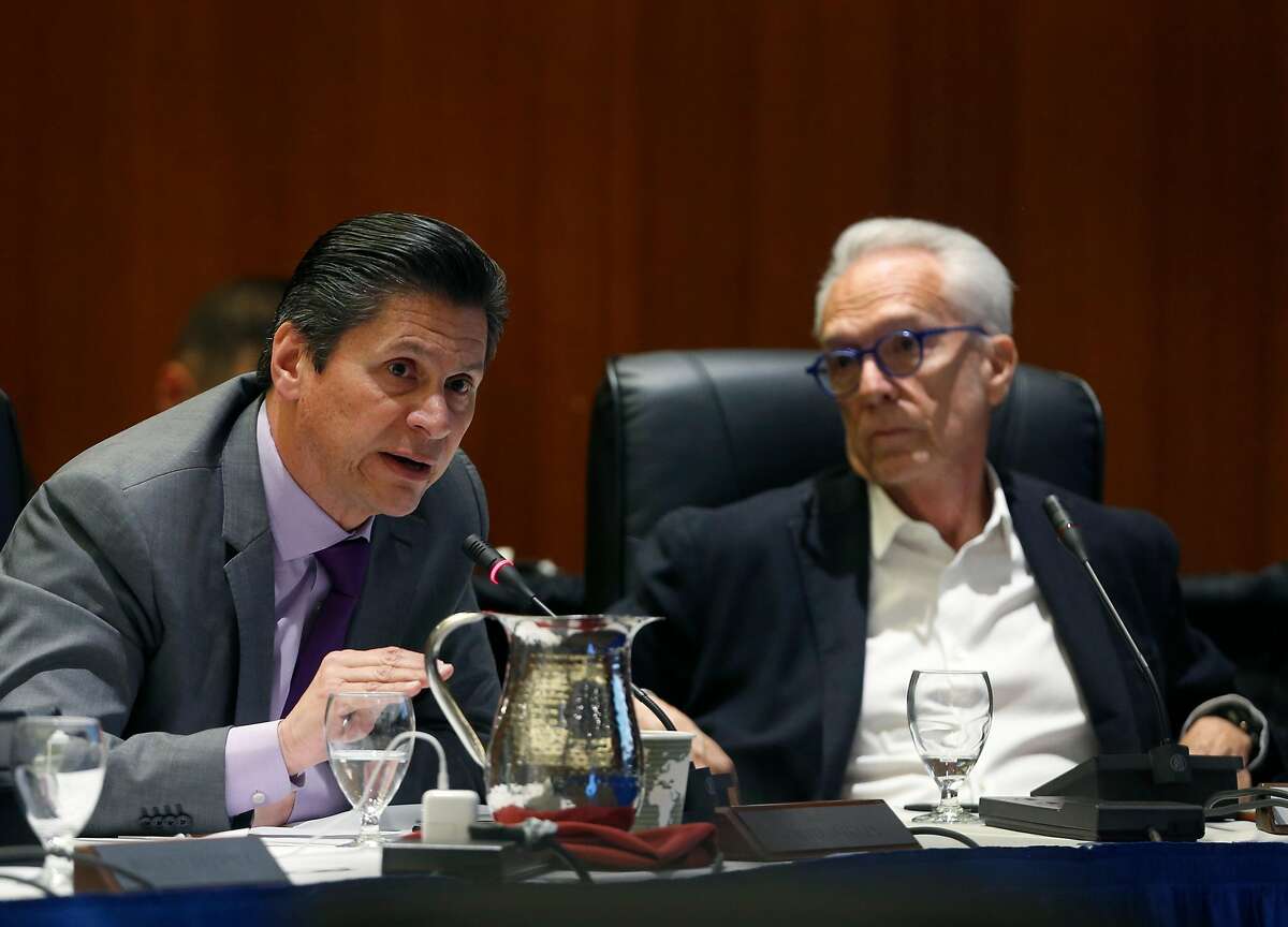 Regent Eloy Ortiz Oakley discusses a proposal to raise student tuition fees as regent Norman Pattiz looks on before the UC Board of Regents voted to approve the plan during a meeting at the UCSF Mission Bay campus in San Francisco, Calif. on Thursday, Jan. 26, 2017.