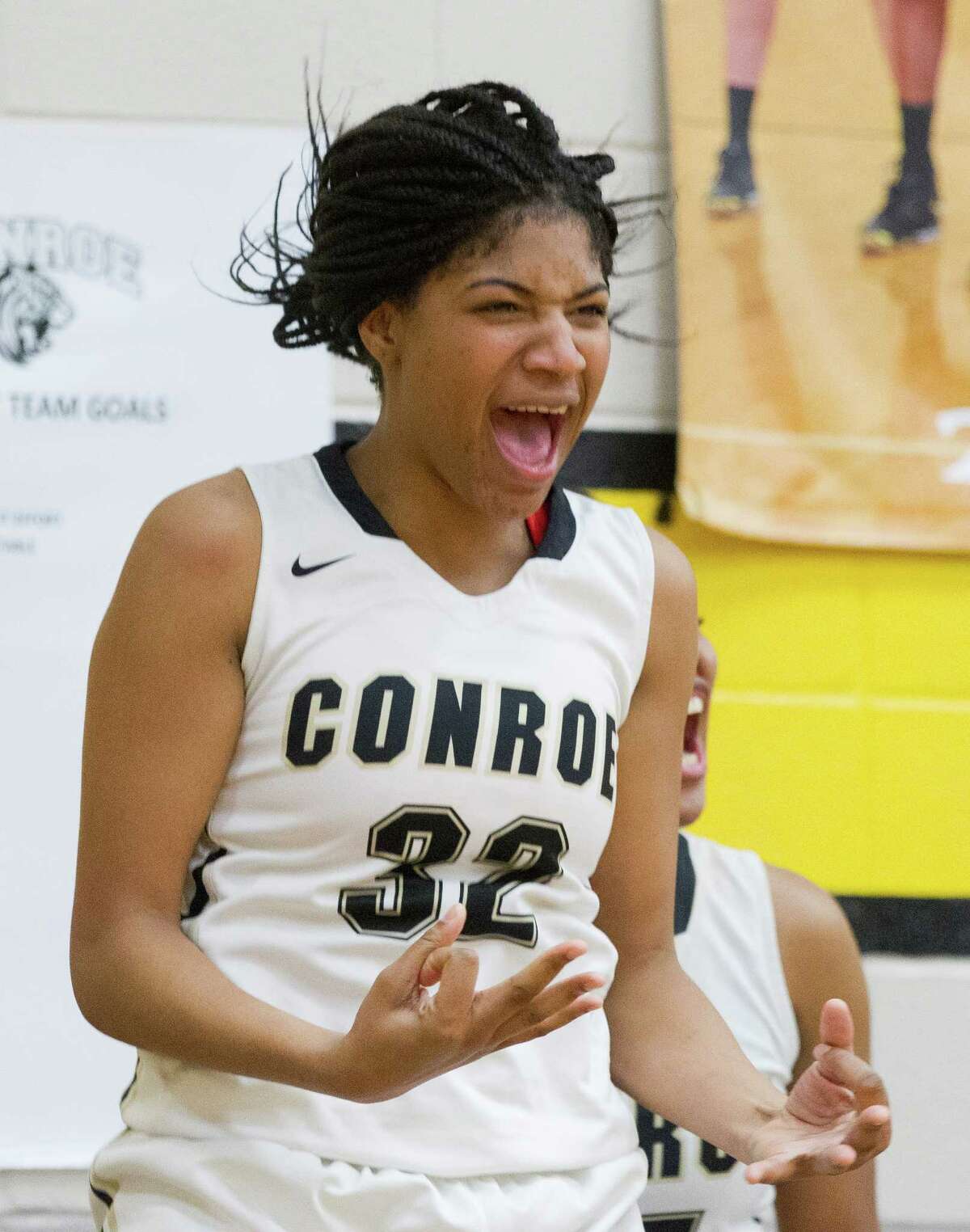 Conroe center Maya Grant (32) celebrates a three-pointer during the third quarter of a District 16-6A high school girls basketball game at Conroe High School, Jan. 24, 2017, in Conroe. Conroe defeated Montgomery 80-28.