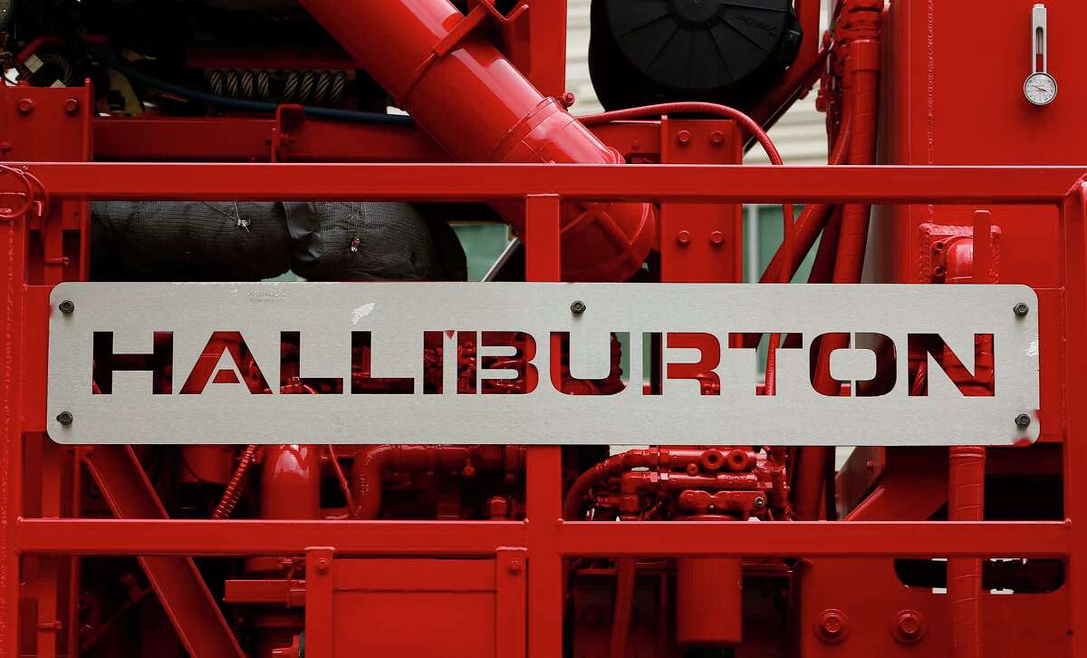 Halliburton, which displays its logo on a pressure pump outside a Houston facility, has extended its deadline for gaining regulatory approval to buy competitor Baker Hughes. (Bloomberg photo)