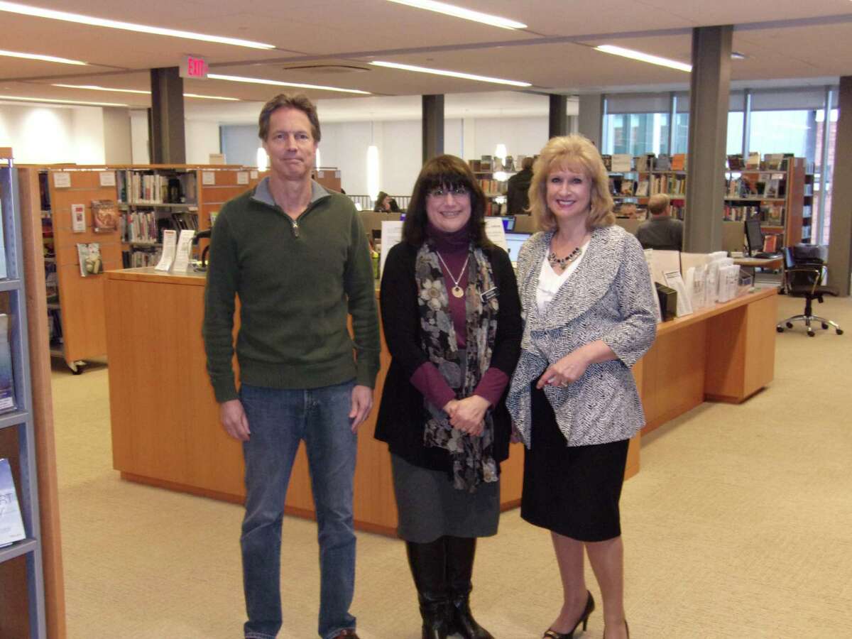 Pictured are Dean Miller, the chairman of the Board of Directors; Brenda McKinley (dark hair), the director of the Ridgefield Library; and Laureen Bubniak, the development director for the Ridgefield Library.