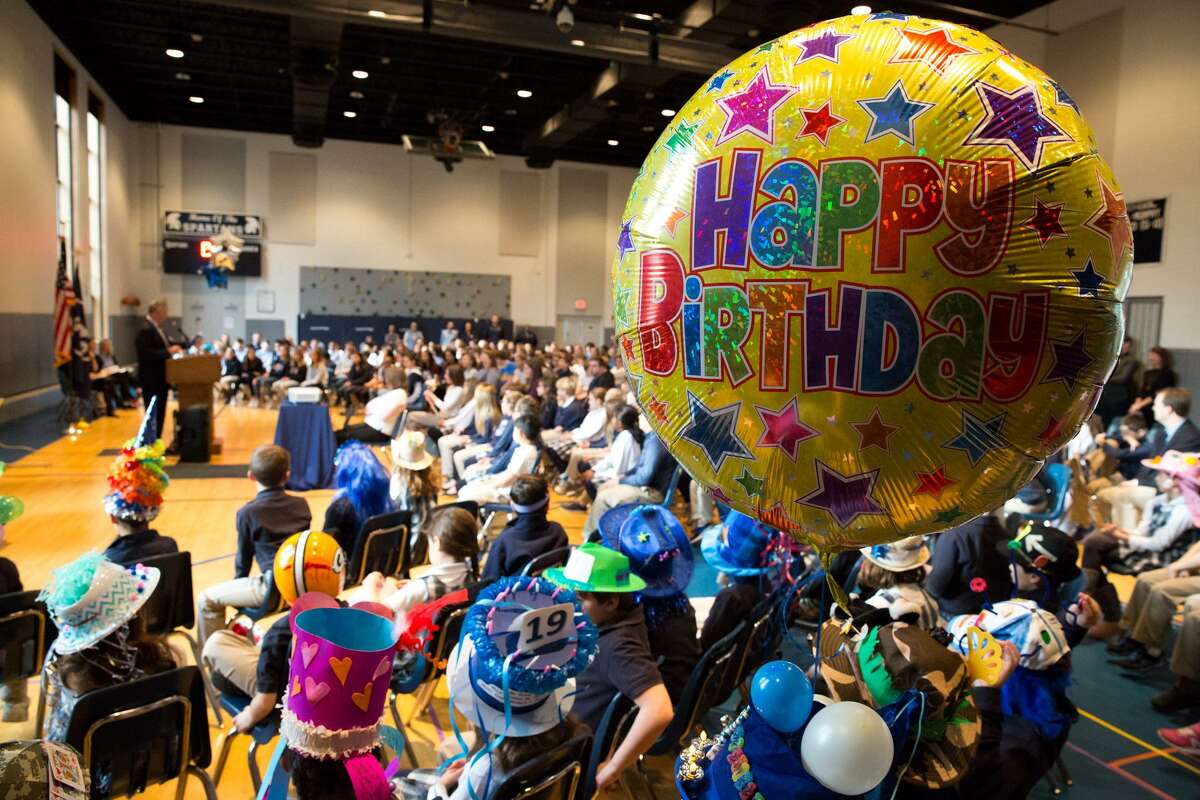 Students and faculty gather in the gymnasium of the Stanwich School to celebrate the school's 19th birthday celebration on Friday morning in Greenwich, Conn.