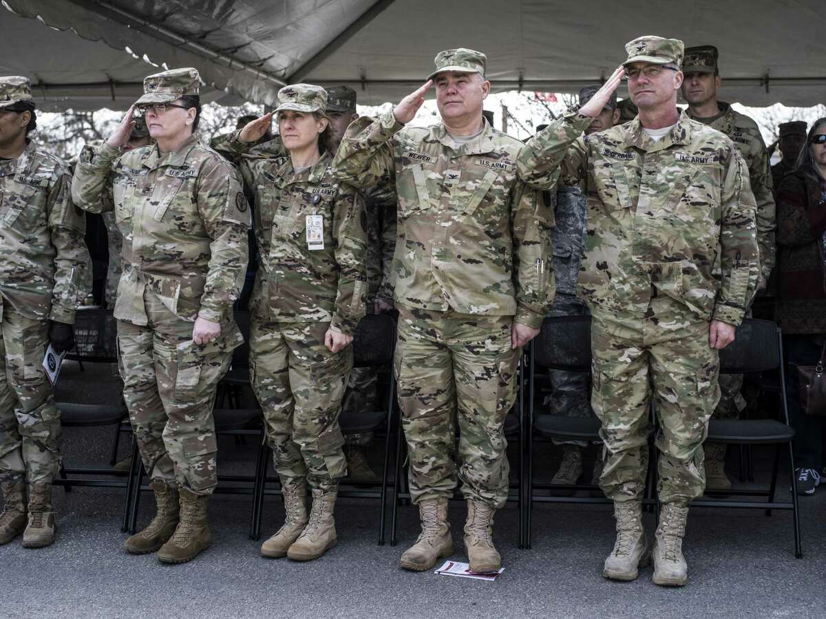 Army soldiers stand at attention during the playing of the National Anthem during the Center For the Intrepid's 10th year anniversary in San Antonio, Texas on Friday, January 27, 2017.