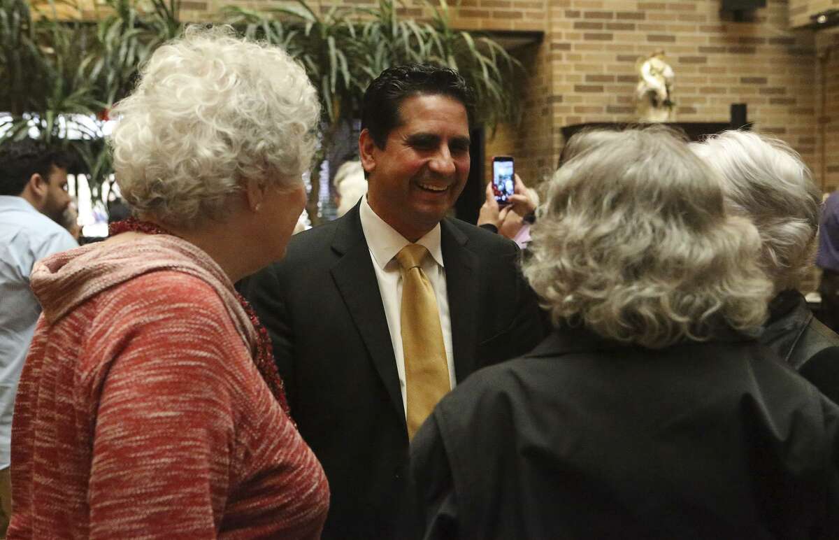 Bexar County Democratic Party Chair Manuel Medina (facing) also took part in the forum.