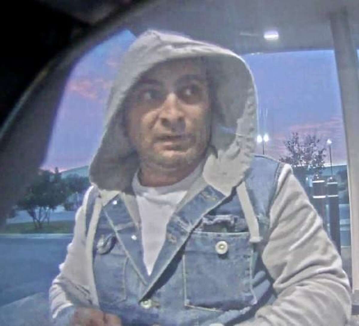 An image released by San Antonio Police Department detectives shows one of two men suspected of placing a card skimmer over an ATM on Friday near Blanco Road and Loop 410.