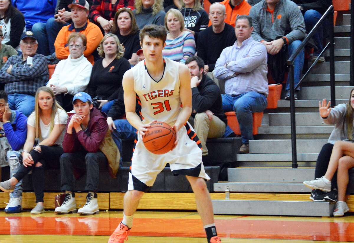 Edwardsville senior guard Oliver Stephen eyes up a 3-pointer in the fourth quarter. Stephen hit the shot to eclipse 1,000 career points.