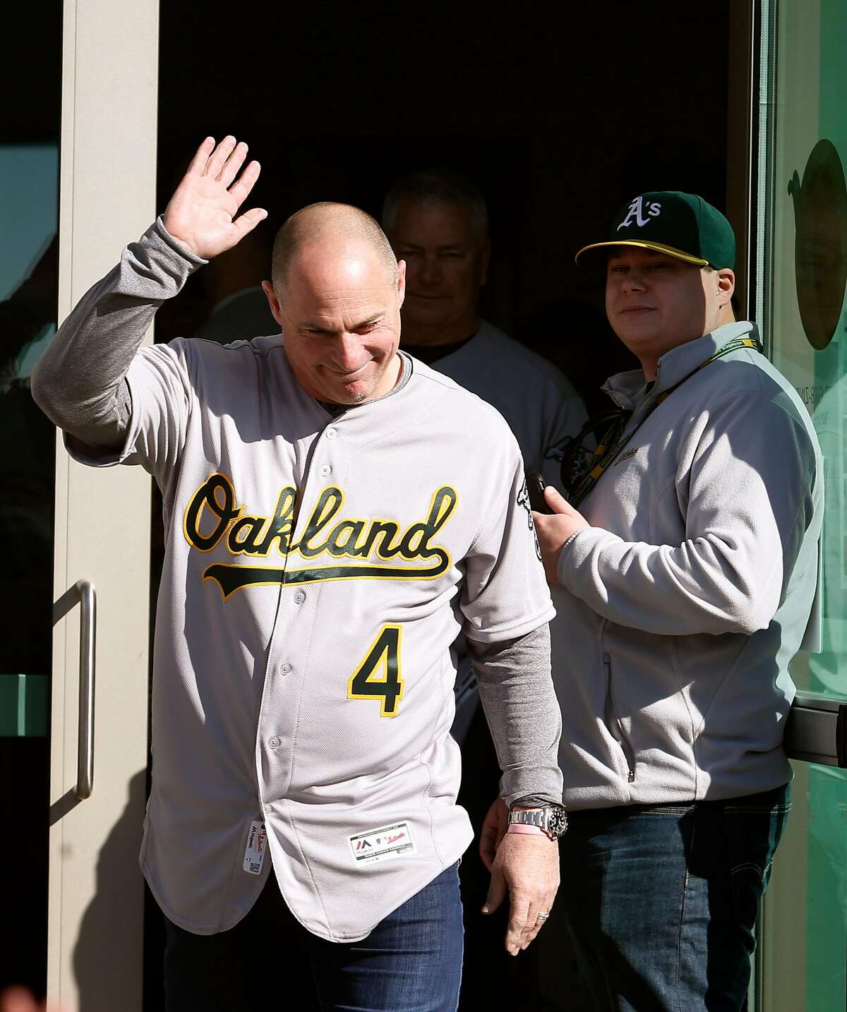 Third base coach Chip Hale waves as he's introduced to fans at the Oakland A's FanFest celebration on Jack London Square in Oakland, Calif. on Saturday, Jan. 28, 2017.