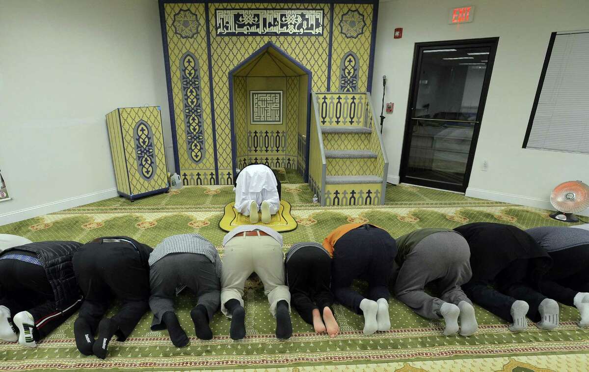 Imam Haqqani Qadri leads a group in evening prayers at the Stamford Islamic Center on Dec. 29, 2016.