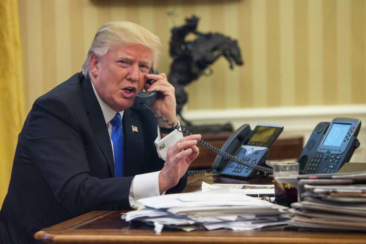 President Donald Trump speaks on the phone with Australian Prime Minister Malcolm Turnbull in the Oval Office of the White House, in Washington, Jan. 28, 2017. President Trump spoke on the phone with several world leaders, including Russian President Vladimir Putin and German Chancellor Angela Merkel. (Al Drago/The New York Times) ORG XMIT: XNYT67