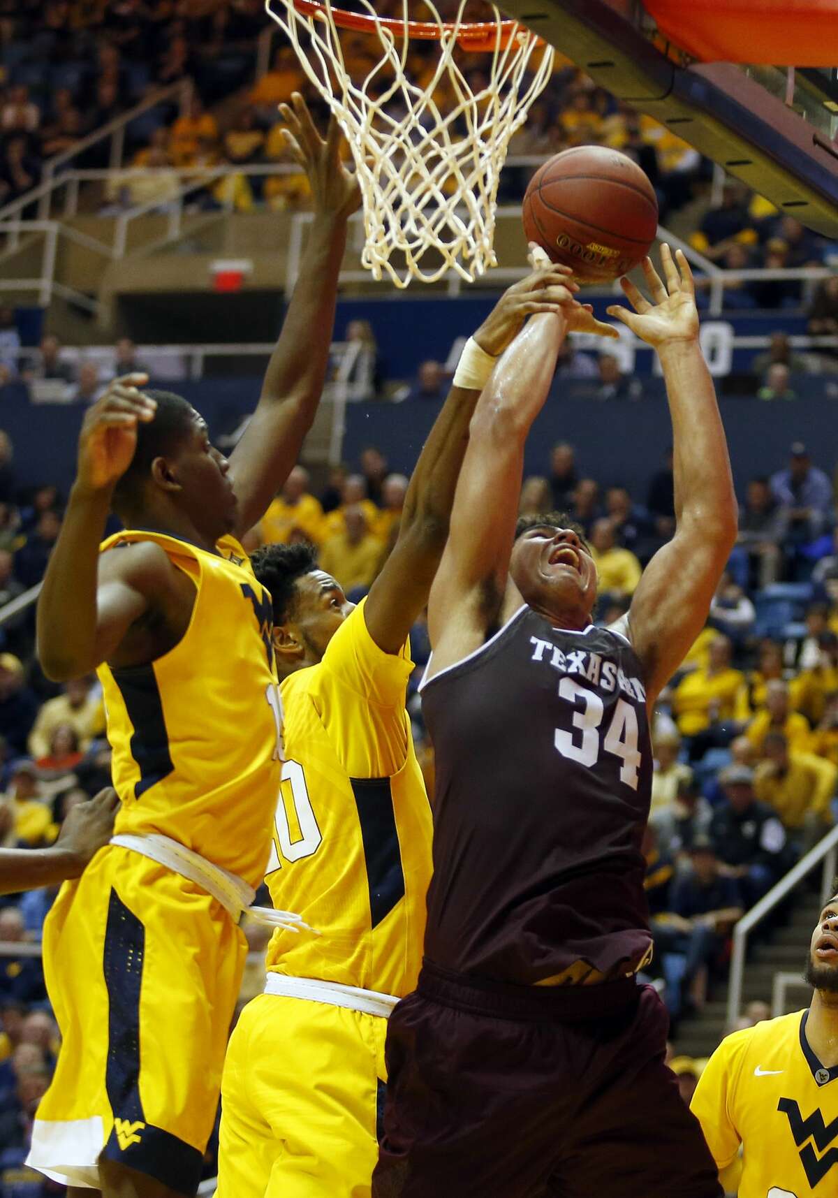 MORGANTOWN, WV - JANUARY 28: Tyler Davis #34 of the Texas A&M Aggies is fouled against the West Virginia Mountaineers at the WVU Coliseum on January 28, 2017 in Morgantown, West Virginia. (Photo by Justin K. Aller/Getty Images)