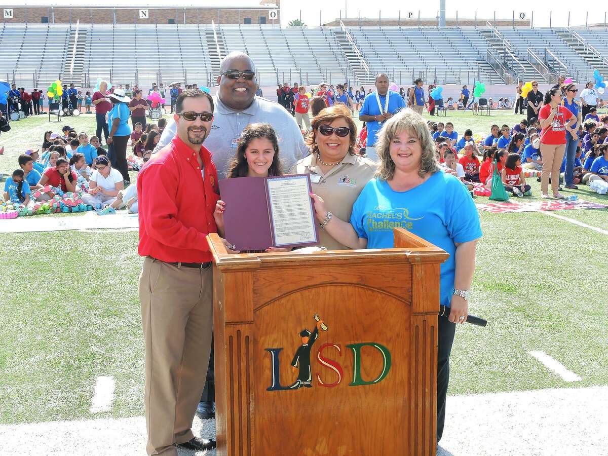 In this May 2014 file photo, LISD Superintendent A. Marcus Nelson, back row, poses with administrators, students and Webb County Attorney Marco Montemayor after Montemayor presented them with an Anti-Bullying Proclamation at the third annual Rachel's Challenge end-of-school-year ceremony at Shirley Field.