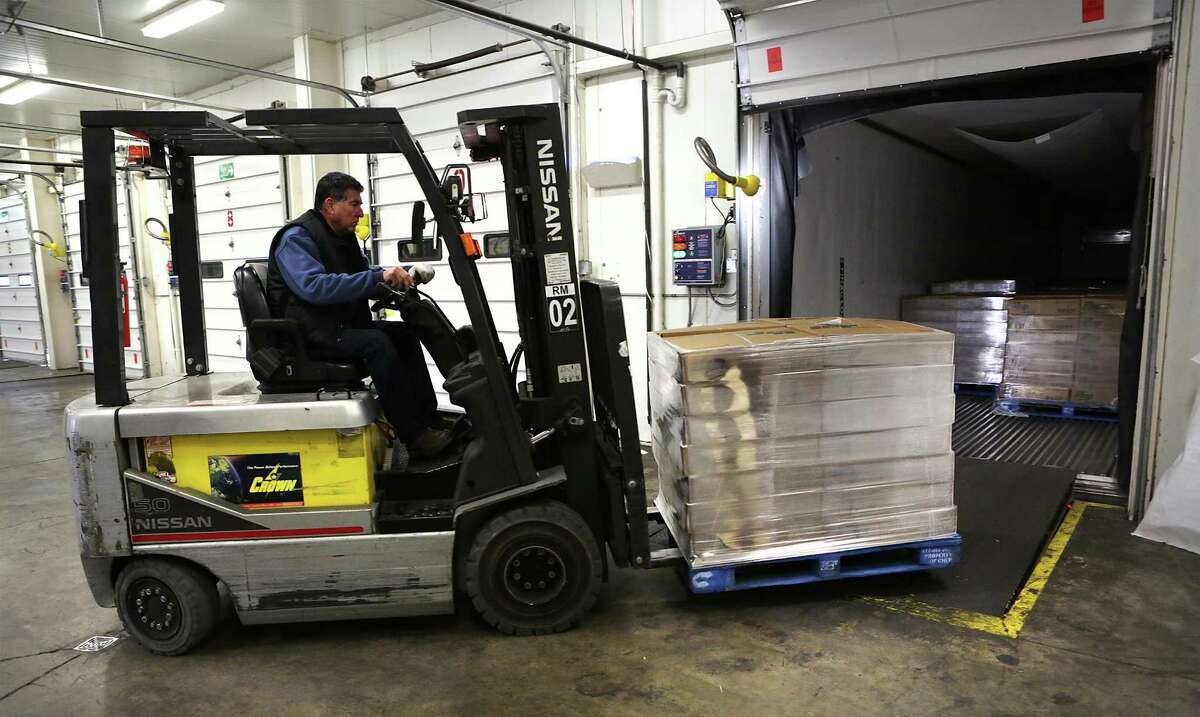 A fork lift operator at Palos Garza, a customs broker company in Laredo, Tx, transfers a load from U.S. truck to another one that will take the goods to Mexico, on Friday, Jan. 27, 2017.