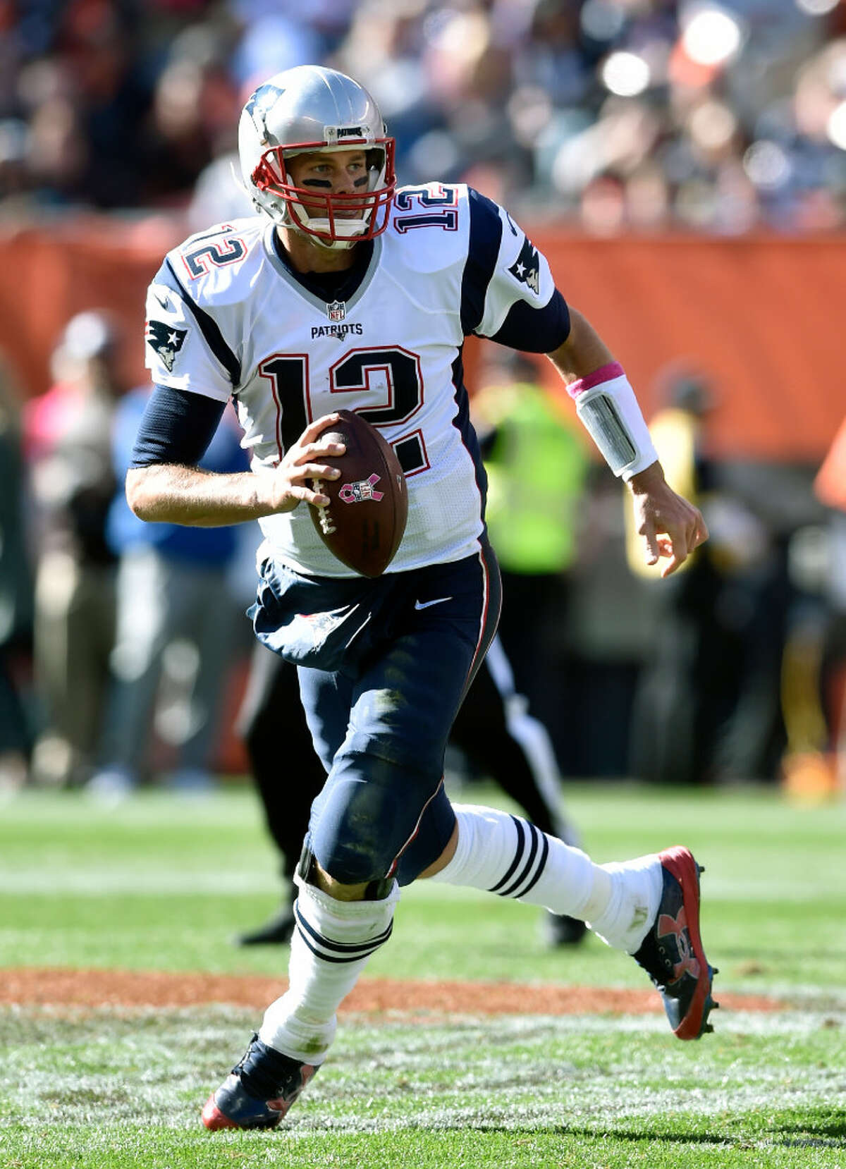 FILE - In this Oct. 9, 2016, file photo, New England Patriots quarterback Tom Brady (12) runs with the ball during an NFL football game against the Cleveland Browns, in Cleveland. The Falcons (13-5) take on the New England Patriots (16-2) in Super Bowl LI in Houston on Feb. 5, 2017. (AP Photo/David Richard)