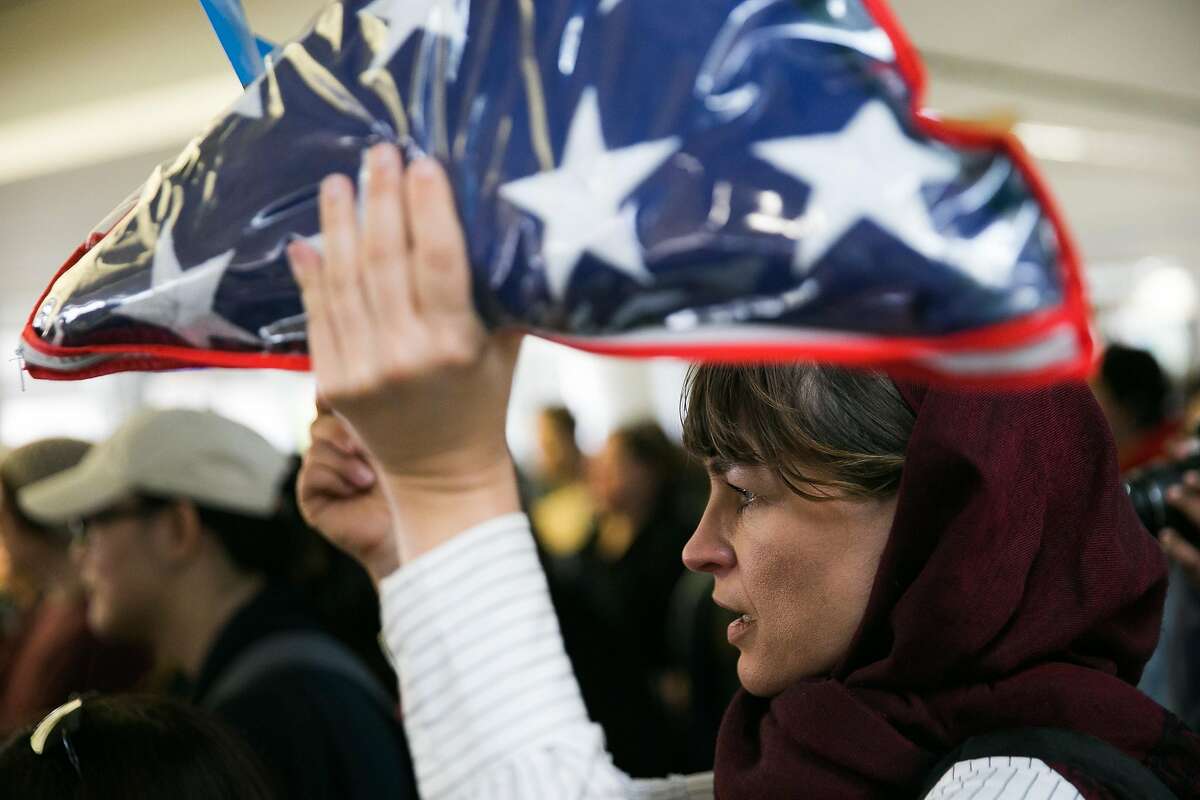 Cheri Renne demonstrates at the San Francisco Airport in San Francisco, Calif., for a demonstration against Donald Trump's executive order that bars citizen of seven from predominately Muslim countries from entering the U.S., Sunday, January 29, 2017.