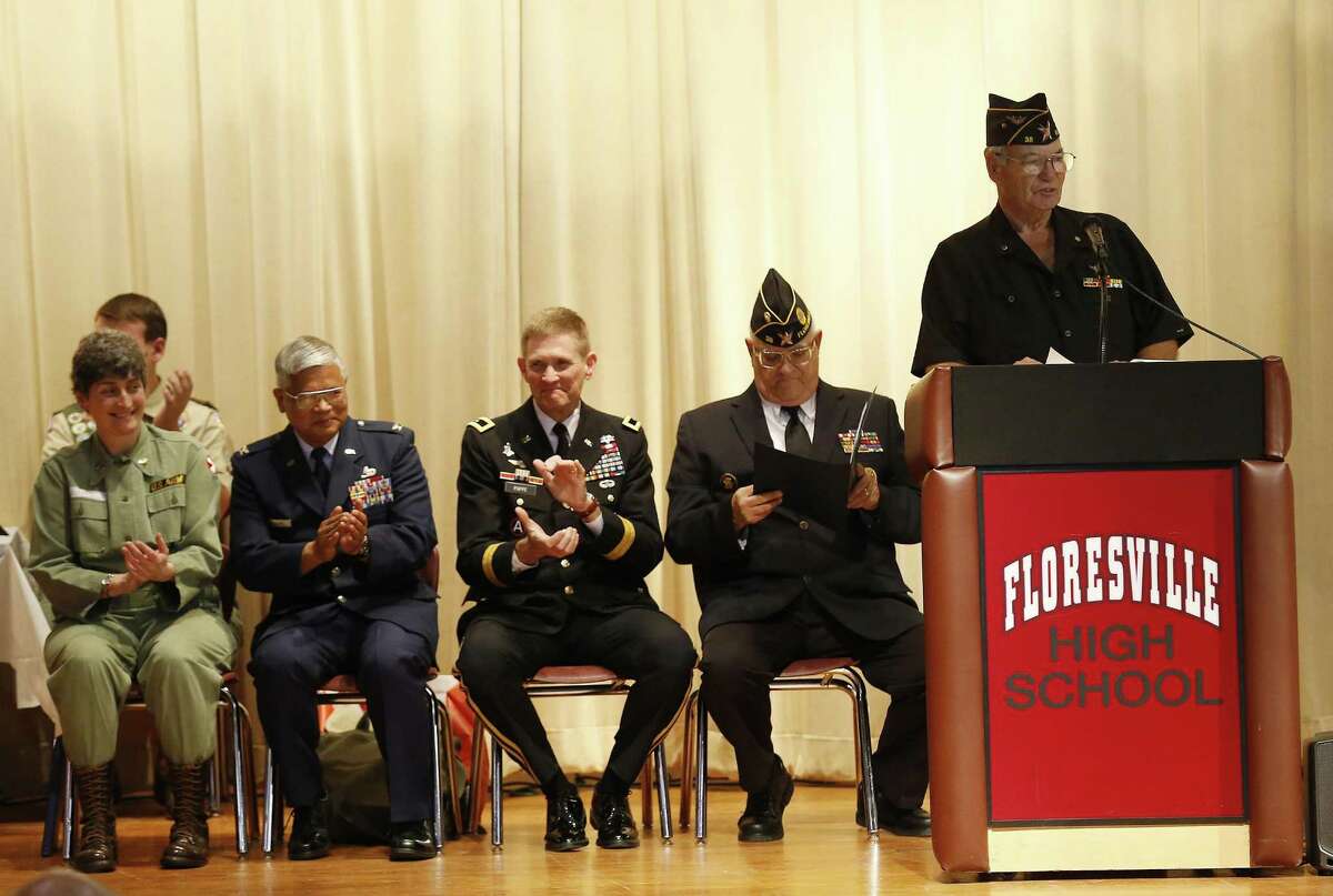Darryl Brown, U.S. Navy veteran and VFW Post 38 member, speaks during a ceremony honoring Chief Warrant Officer Ralph Edwin Ellis who was a prisoner of war in the Philippines during World War II at Floresville High School on Saturday, Jan. 28, 2017. Guests included veterans, citizens and area American Legionnaires honoring Ellis as well as other POWs in the 71st anniversary of the raid on Cabanatuan Prisoner of War Camp in the Philippines on Saturday. Ellis passed away in the 1960s but the belongings of his life especially when he was soldier during World War II came to light for his surviving family members. This came to the attention of fellow veterans at American Legion Post 38 in Floresville and they determined that Ellis and other POWs needed to be honored with an event. Along with guest military speakers who spoke about military life in the Pacific Theater during WWII, guests were treated to traditional Philippine dances and patriotic hymns. The event concluded with a ceremonial flag folding by U.S. Army Military Honor Guard from JBSA-Fort Sam Houston and the playing of Amazing Grace by Alamo Pipes and Drums Corps. (Kin Man Hui/San Antonio Express-News)