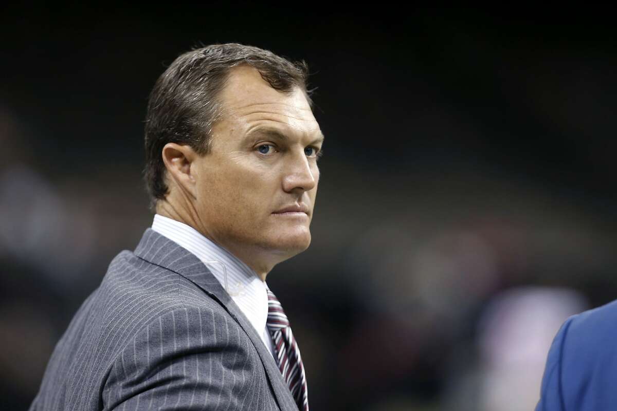 This Nov. 9, 2014 photo shows former NFL player John Lynch on the sideline before an NFL football game between the New Orleans Saints and the San Francisco 49ers in New Orleans. The San Francisco 49ers have hired Lynch to be their general manager. After a lengthy search that included interviews with nine other publicly identified candidates, team CEO Jed York settled on a mystery candidate when he gave the job to Lynch on Sunday, Jan. 29, 2017. 