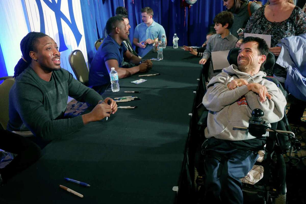 Paul Perkins, left, a running back for the New York Giants, talks with Giants fan, Brian Jabot of Queensbury, at the #518Gives Telethon to benefit the Center for Disability Services on Sunday, Jan. 29, 2017, in Albany, N.Y. (Paul Buckowski / Times Union)