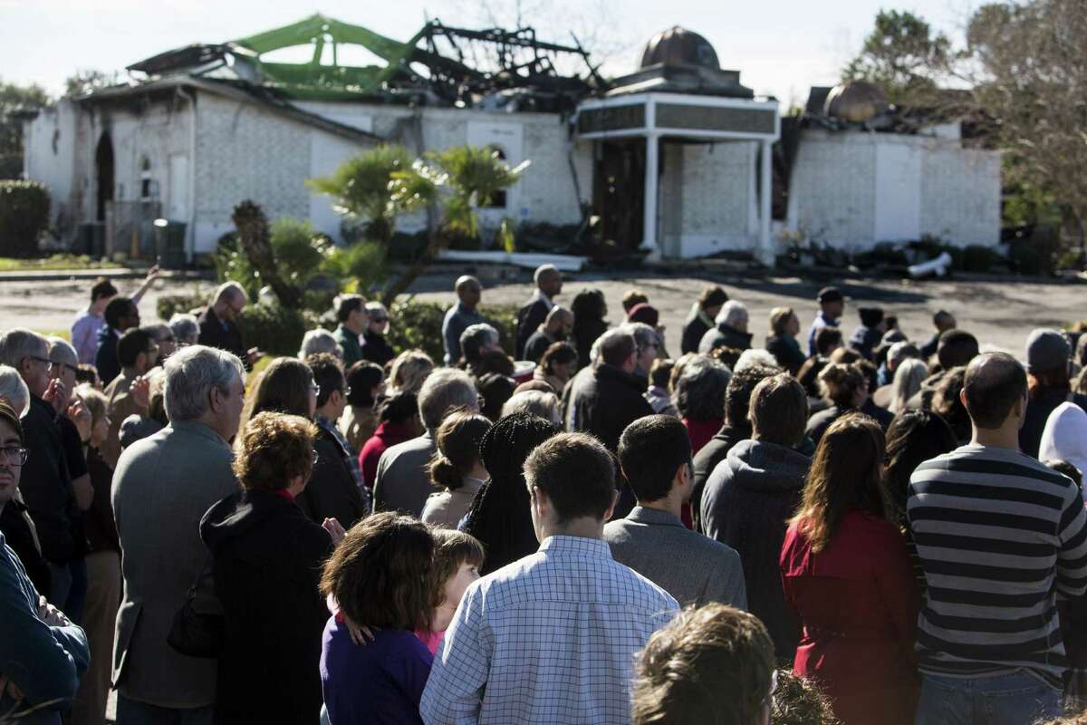 Hundreds of people gather outside the Islamic Center of Victoria for prayers of several faiths and to show support for the muslim community after the mosque burned in Victoria, Texas on January 29, 2017.