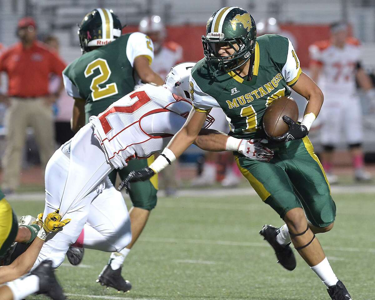 Running back Branden Gutierrez carries the ball in Saturday's district game between the Nixon Mustangs and the Sharyland Rattlers at Shirley Field.