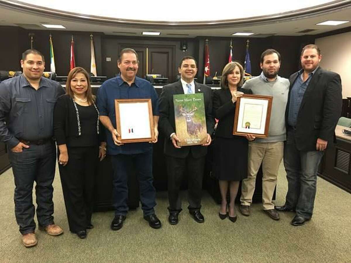 Congressman Cuellar honors the family of the late John McKeown, a U.S. Navy and Korean War veteran, and professional photographer Fidel ?“Butch?” Ramirez during a ceremony at Laredo City Hall on Thursday. Pictured from left are Tony Ramirez, Zita Ramirez, Fidel Ramirez, Cuellar, Carolyn McKeown, Eduardo Hinojosa Jr. and Ari Hoffman.