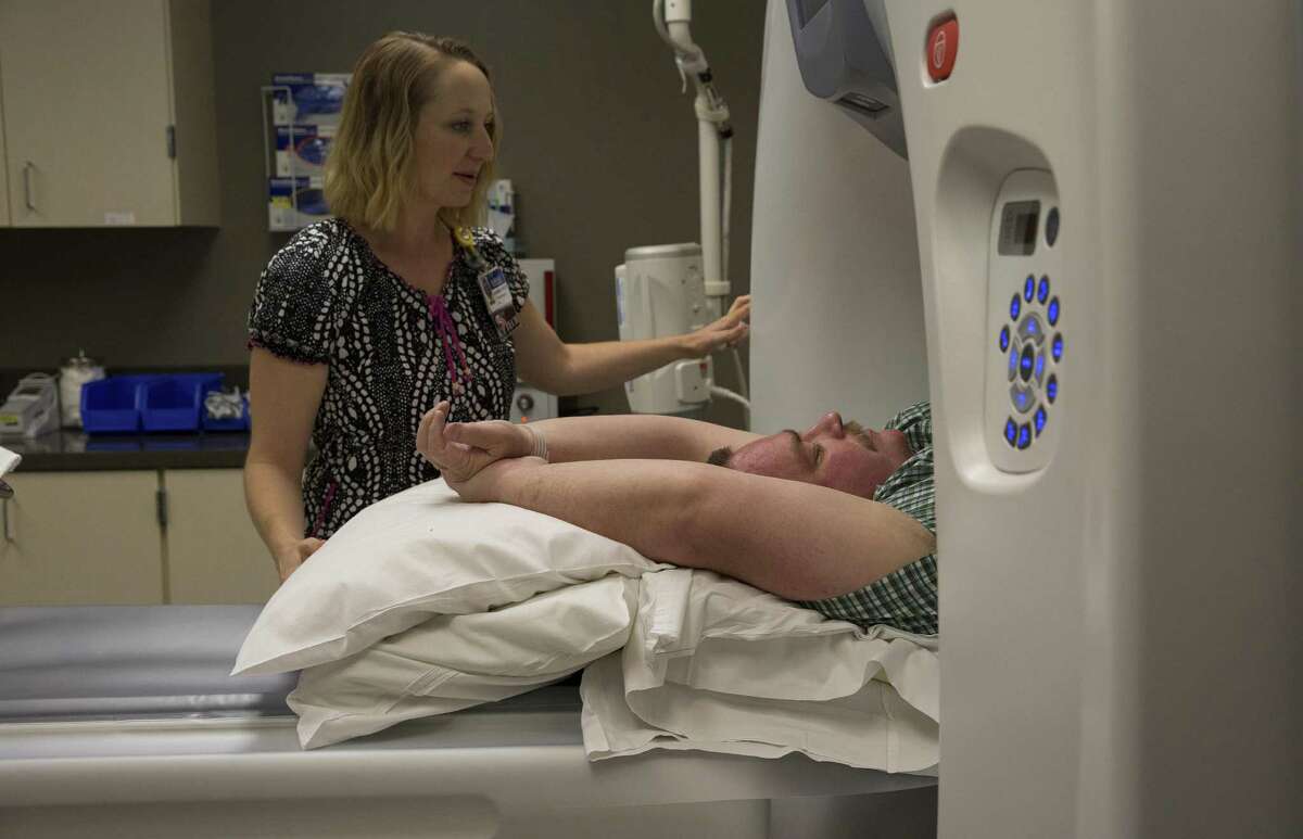 Tim Snider, an Enewetak Atoll veteran who has tumors on his ribs, spine and skull, gets a bone scan in Pasco, Wash., Sept. 16, 2016. Roughly 4,000 troops were sent to the atoll to clean the fallout from dozens of nuclear tests there, despite high radiation levels and a lack of safety equipment. Many now have ailments they think result from the work, but the government won?’t provide health care. (Ruth Fremson/The New York Times)