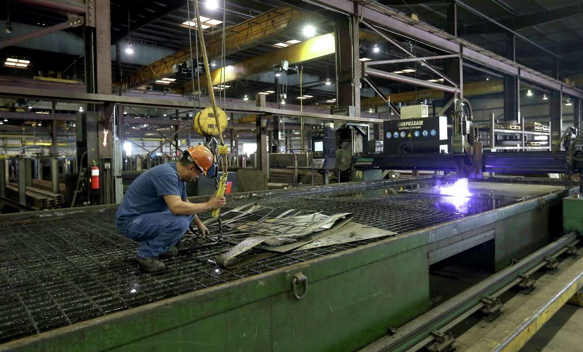 A worker at Alamo Iron Works operates a plasma burning table at the company’s San Antonio fabrication facility. The Federal Reserve Bank of Dallas released its Texas Manufacturing Outlook Survey, which shows continued growth for Texas manufacturers.