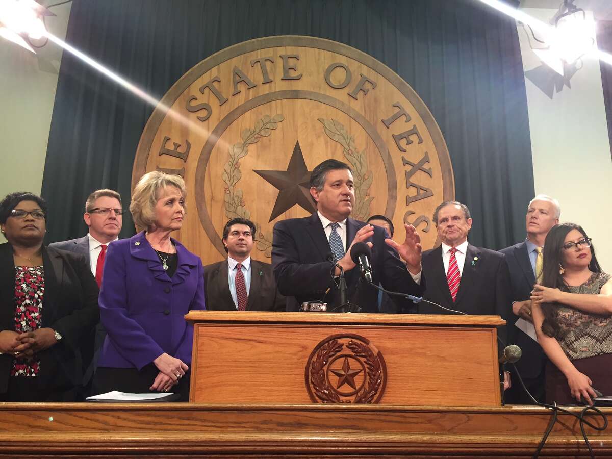 State Rep. Richard Pena Raymond, D-Laredo, and other lawmakers in a legislative working group unveil their plans to improve Child Protective Services and the state's foster care system at a press conference at the state Capitol on Jan. 30, 2017. 