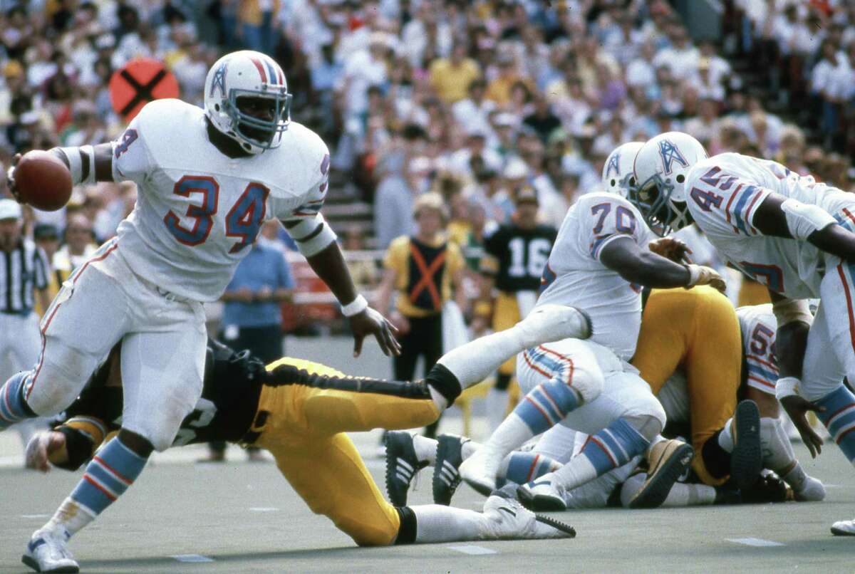 Houston Oilers’ Earl Campbell (34) finds running room against the Pittsburgh Steelers at Three Rivers Stadium on Sept. 7, 1980.