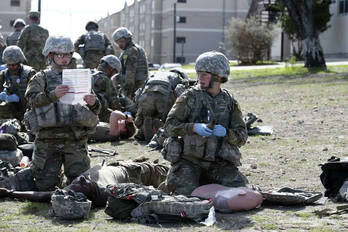 U.S. Army medics in training Pvt. 2 Erin Owens, left, 19, of St. Marys, Ohio and Pfc. Beth Minyard, 19, of Benton, Arkansas, go through an exercise at Joint Base San Antonio-Fort Sam Houston, Tuesday, Jan. 24, 2017. Former President Obama’s initiative to open up the last combat specialties that have long been closed to women could be in jeopardy now that retired Marine Gen. James Mattis is likely to become the next defense secretary under President-elect Donald Trump.