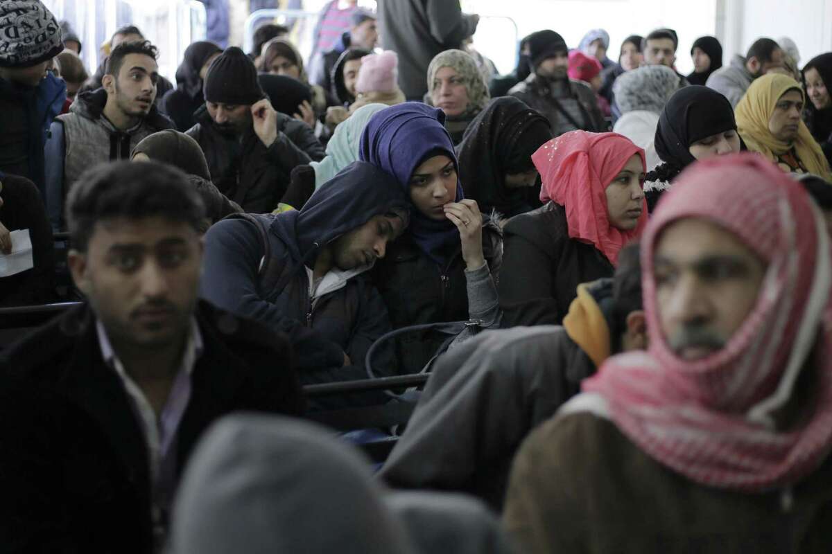 Hundred of Syrian families wait to register at the United Nations High Commissioner for Refugees headquarters, in Beirut, Lebanon on Jan. 30. President Donald Trump imposed a 90-day ban, Friday, that affects travel to the U.S. by citizens of Iraq, Syria, Iran, Sudan, Libya, Somalia and Yemen and puts an indefinite hold on a program resettling Syrian refugees.