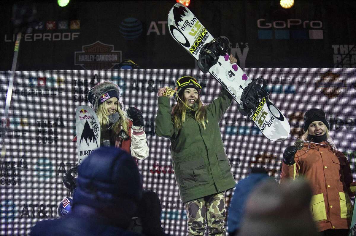 California teen Hailey Langland, center, stands on the podium at Buttermilk Ski Area in first place after competing in the women's big air final Thursday, Jan. 26, 2017, just north of Aspen, Colo. Anna Gasser, left, came in second place, while Julia Marino took 3rd place. (Anna Stonehouse/The Aspen Times via AP)